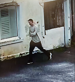 16-yr-olf white male on CCTV image walking down street wearing a beige jumper and black trousers