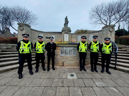 Police officers stand in front of Carnoustie War Memorial paying their respects on Remembrance Sunday