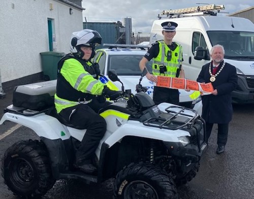 Pictured is Chief Inspector Ben Leathes, Provost of East Lothian John MacMillan, and PC Fiona Harrison pictured on the quad bike