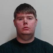 Image of jailed man Ralph Fairhurst - heavy built young man with short dark hair wearing black tshirt