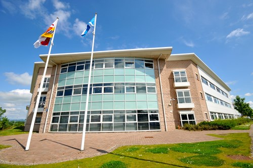 A photo of Angus House, HQ of Angus Council, in Forfar on a day with blue skies and light cloud